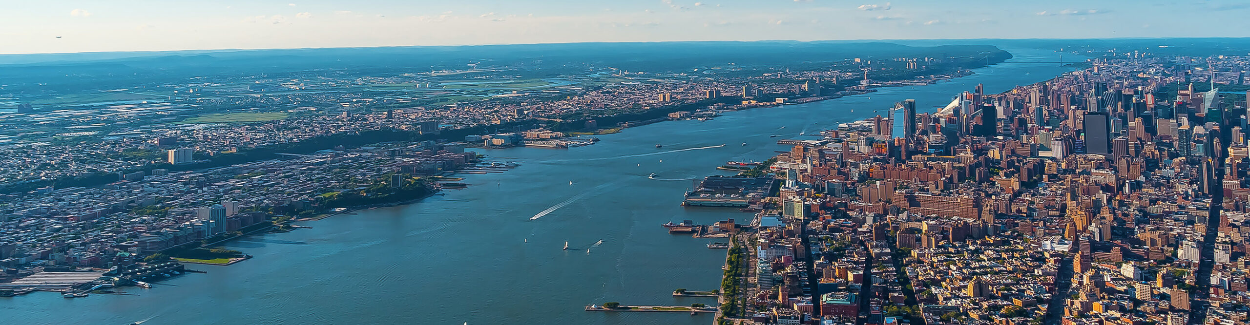 Century Air flying over the Hudson River and New York City Skyline