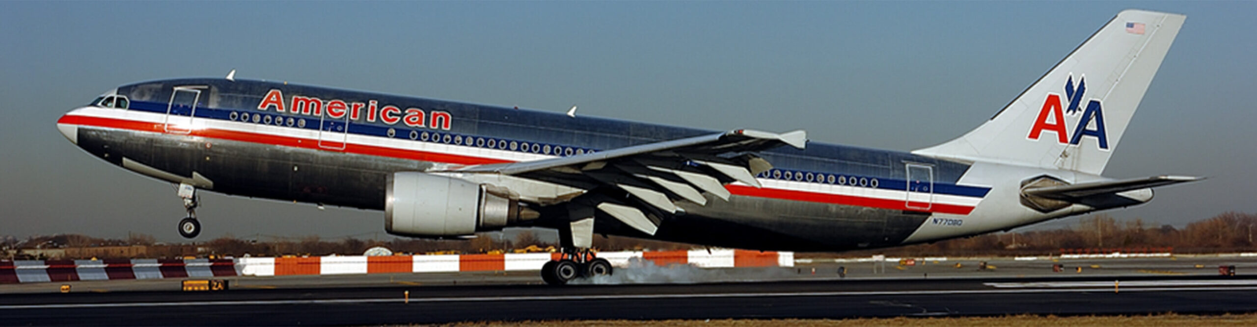 American Airlines airplane taking off from runway in Newark, NJ