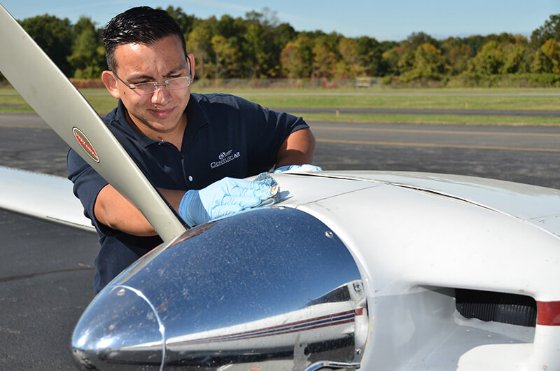 Century Air Flight Training School team cleaning aircraft at Essex County Airport in Fiarfild, NJ